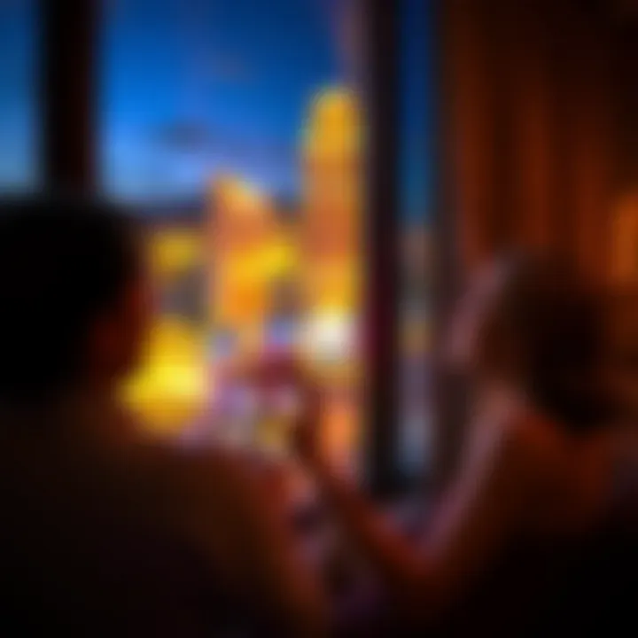 Guests Enjoying Night View of the Strip Guests enjoying the stunning night view of the Las Vegas Strip from their room